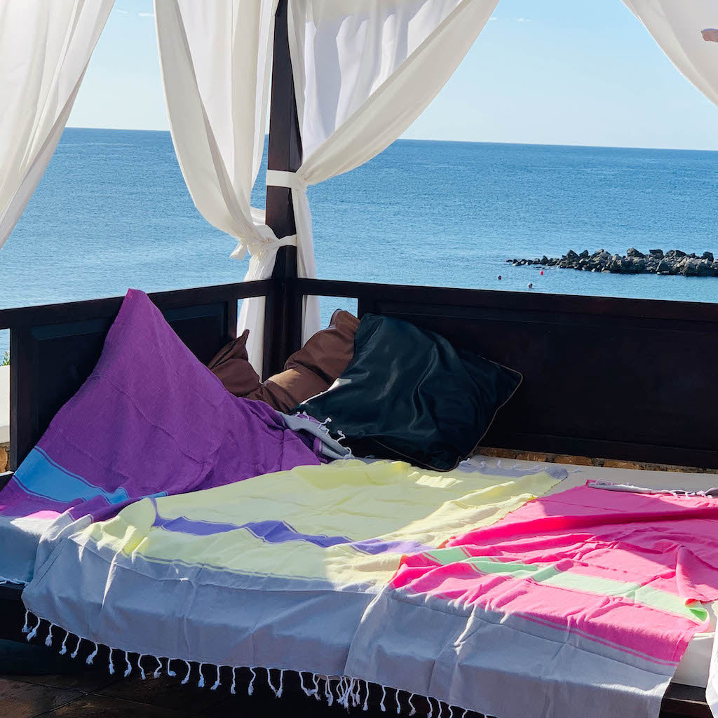 talia hammam towels laid out across large sunlounge platform