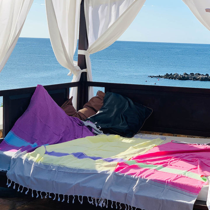 talia hammam towels laid out across large sunlounge platform